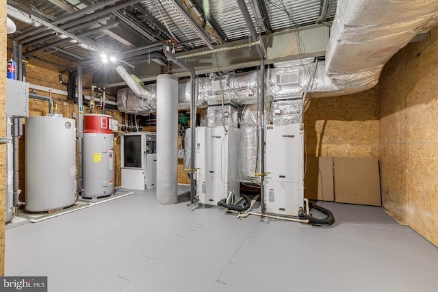 utility room featuring water heater and gas water heater