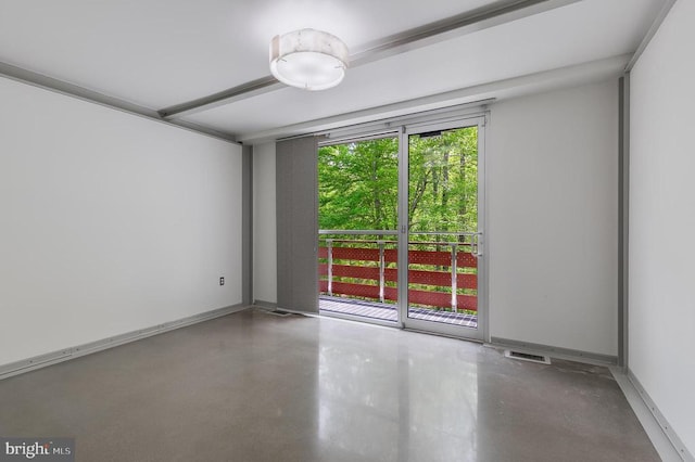 spare room featuring concrete flooring