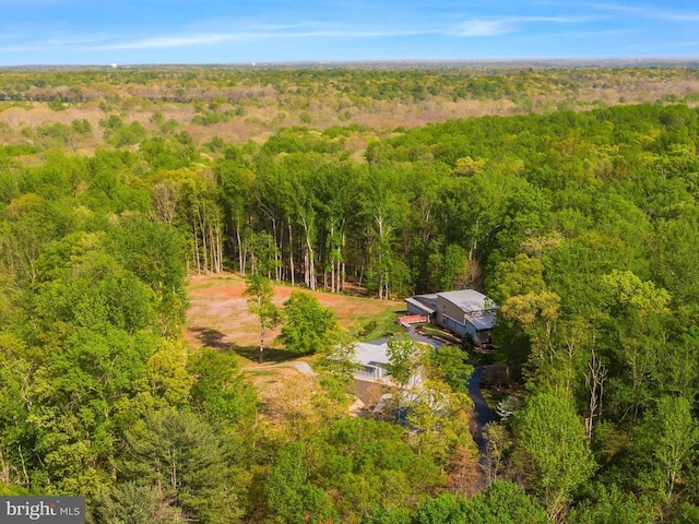  - aerial view of property and surrounding area with a forest
