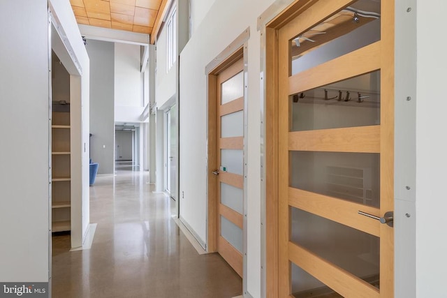 corridor with concrete flooring