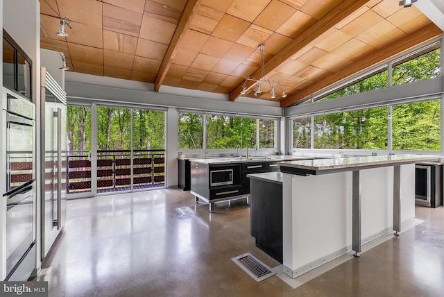  - unfurnished sunroom featuring wine cooler