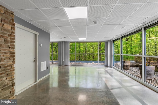 unfurnished sunroom with visible vents