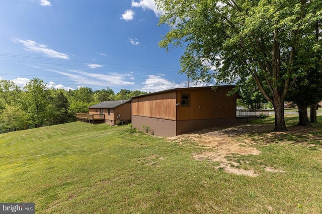 view of property exterior with a lawn