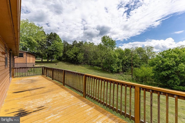 wooden deck with a yard
