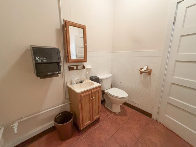 1203 Windsor Ln, Staunton, VA 24401 - bathroom featuring toilet, tile patterned flooring, vanity, wainscoting, and tile walls