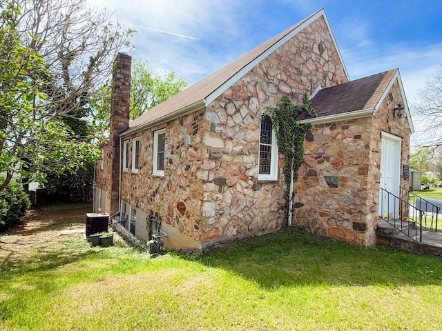 1203 Windsor Ln, Staunton, VA 24401 - view of property exterior with stone siding, a chimney, a lawn, and cooling unit