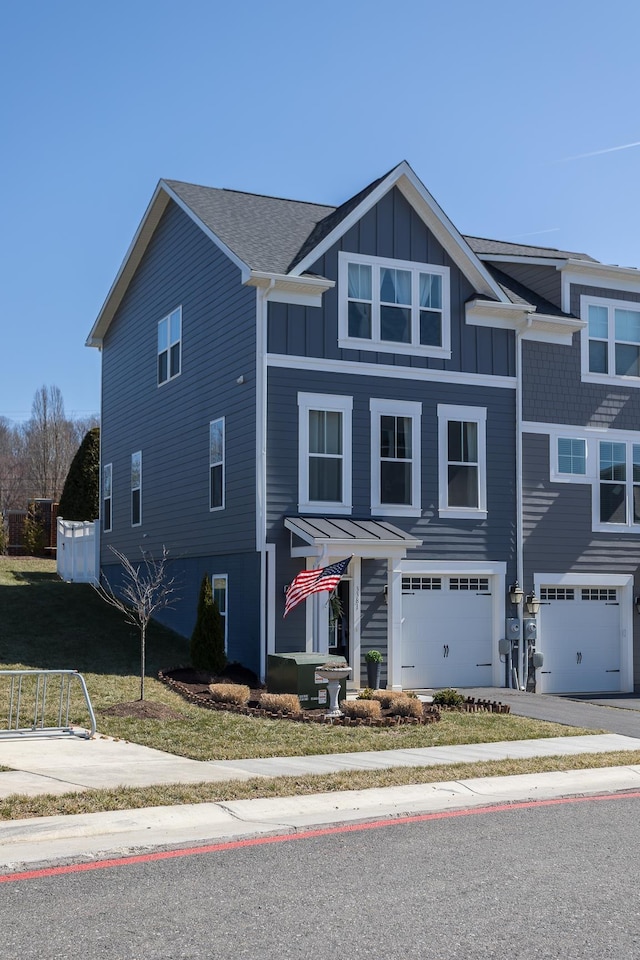 3381 Monterey Dr, Rockingham, VA 22801 - view of front of property featuring board and batten siding, a garage, and asphalt driveway
