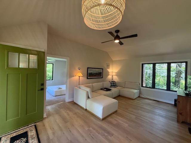 1201 Lakeshore Dr S, Louisa, VA 23093 - living room with lofted ceiling, wood finished floors, a ceiling fan, and baseboards