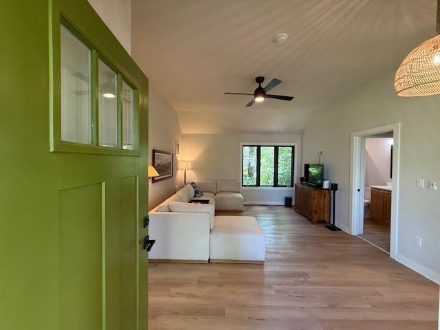 1201 Lakeshore Dr S, Louisa, VA 23093 - living area featuring lofted ceiling, ceiling fan, light wood-type flooring, and baseboards