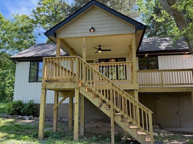 1201 Lakeshore Dr S, Louisa, VA 23093 - back of house featuring ceiling fan, roof with shingles, and stairway