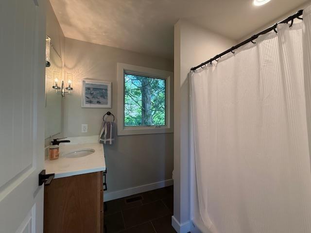 1201 Lakeshore Dr S, Louisa, VA 23093 - bathroom with vanity, tile patterned flooring, baseboards, and a shower with shower curtain