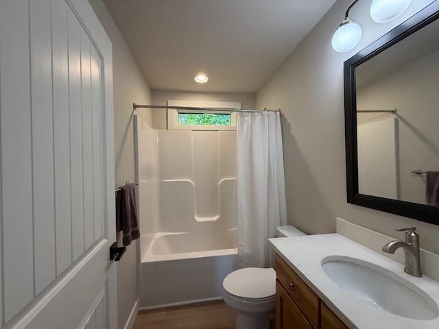 1201 Lakeshore Dr S, Louisa, VA 23093 - bathroom with vanity, toilet, shower / tub combo, wood finished floors, and recessed lighting
