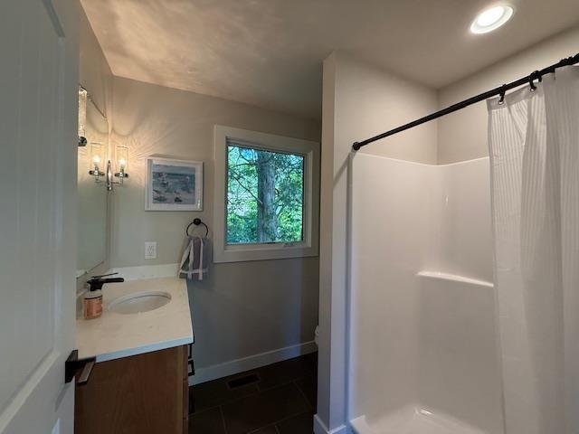 1201 Lakeshore Dr S, Louisa, VA 23093 - full bath with vanity, tile patterned flooring, a shower with curtain, and baseboards