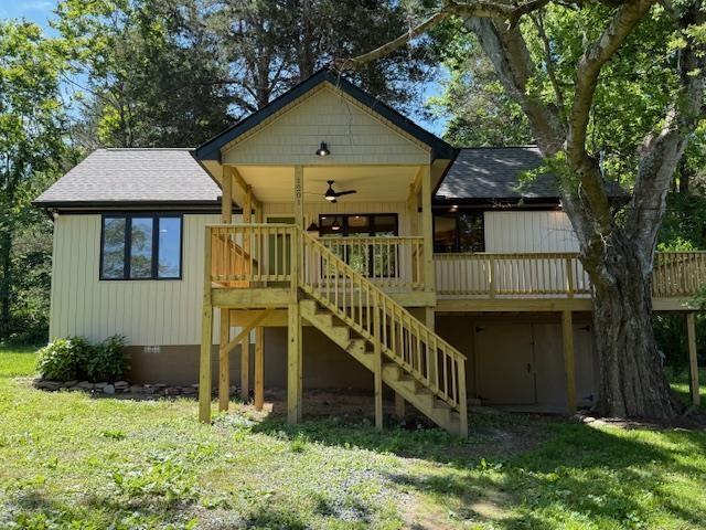 1201 Lakeshore Dr S, Louisa, VA 23093 - rear view of property featuring stairway, a ceiling fan, a yard, and roof with shingles