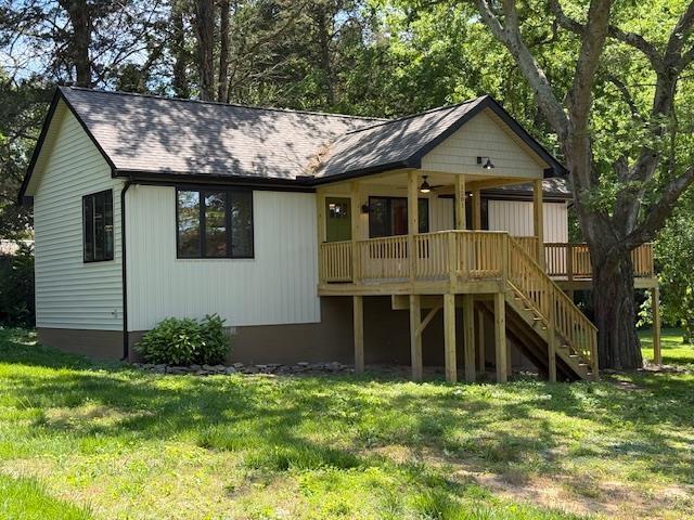 1201 Lakeshore Dr S, Louisa, VA 23093 - view of front of property with stairway, a front yard, and a deck