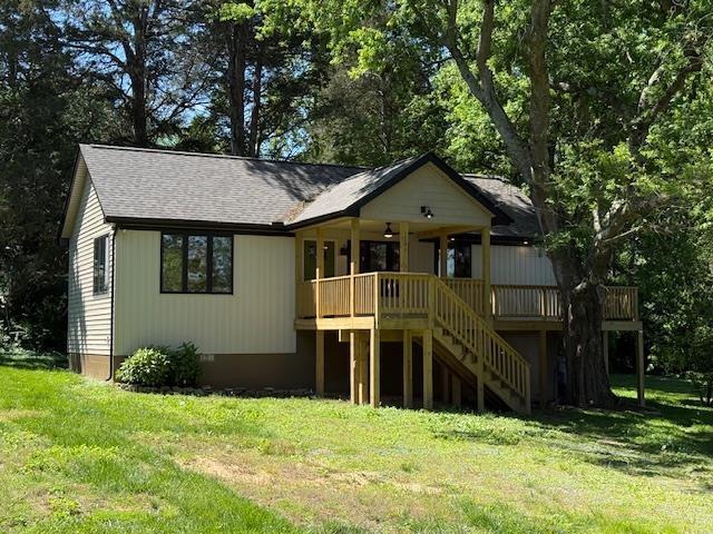 1201 Lakeshore Dr S, Louisa, VA 23093 - view of front of house with stairway, a front yard, a wooden deck, a ceiling fan, and roof with shingles