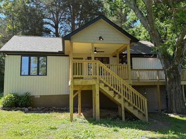 1201 Lakeshore Dr S, Louisa, VA 23093 - view of playground featuring stairs, a ceiling fan, a deck, and a yard