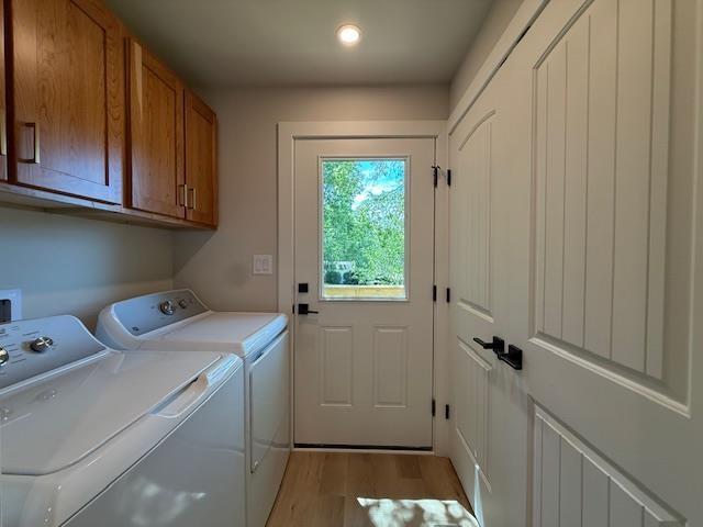 1201 Lakeshore Dr S, Louisa, VA 23093 - laundry room with independent washer and dryer, cabinet space, wood finished floors, and recessed lighting