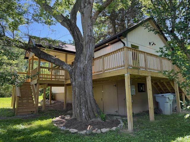 1201 Lakeshore Dr S, Louisa, VA 23093 - back of property featuring stairway, a wooden deck, and a yard