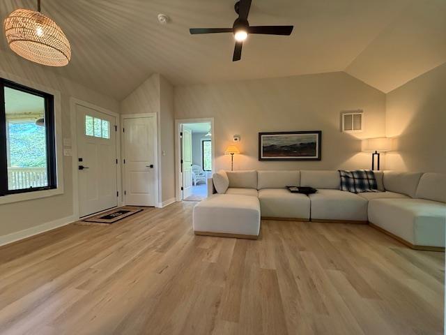 1201 Lakeshore Dr S, Louisa, VA 23093 - living room with lofted ceiling, light wood-style floors, ceiling fan, and baseboards