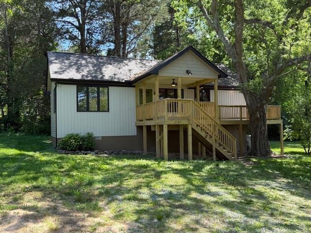 1201 Lakeshore Dr S, Louisa, VA 23093 - view of front facade with stairs, a front lawn, and a wooden deck