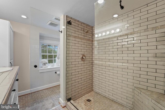 412 Nelmonte Ln, Arrington, VA 22922 - full bath featuring tiled shower, tile patterned floors, vanity, baseboards, and recessed lighting
