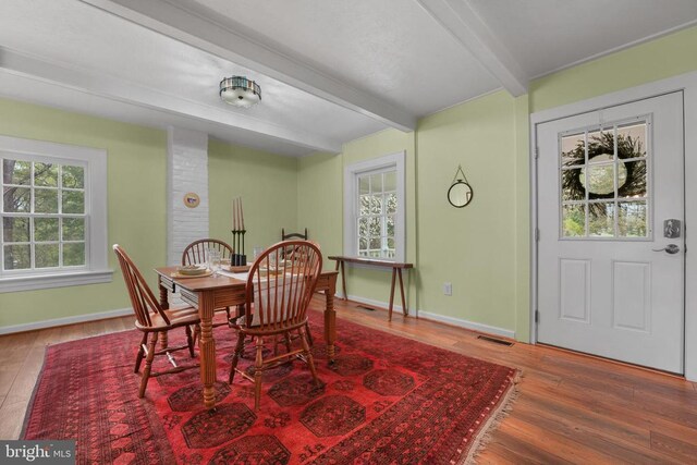 412 Nelmonte Ln, Arrington, VA 22922 - dining space with beamed ceiling, wood finished floors, and baseboards