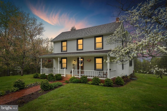 412 Nelmonte Ln, Arrington, VA 22922 - farmhouse-style home with a chimney, covered porch, a front lawn, and roof with shingles