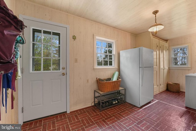 412 Nelmonte Ln, Arrington, VA 22922 - doorway to outside featuring brick flooring, wood walls, wooden ceiling, and washer / dryer