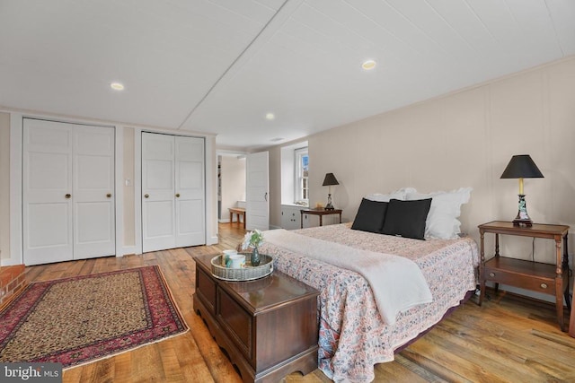 412 Nelmonte Ln, Arrington, VA 22922 - bedroom featuring light wood-style floors, two closets, and recessed lighting