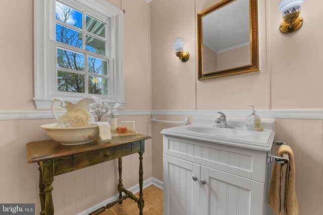 412 Nelmonte Ln, Arrington, VA 22922 - bathroom featuring wainscoting, a decorative wall, and vanity