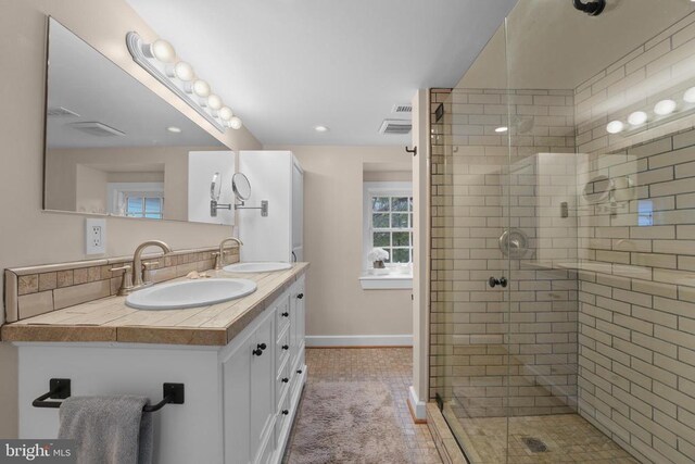 412 Nelmonte Ln, Arrington, VA 22922 - bathroom with baseboards, a stall shower, double vanity, and recessed lighting