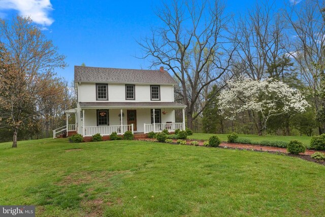 412 Nelmonte Ln, Arrington, VA 22922 - farmhouse-style home with a porch, a chimney, and a front yard