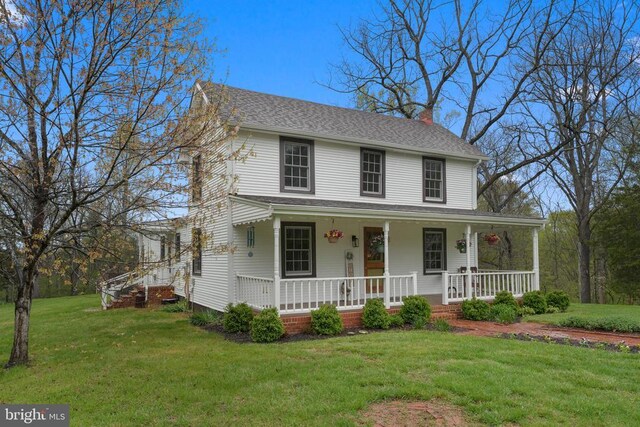 412 Nelmonte Ln, Arrington, VA 22922 - farmhouse-style home with covered porch, a chimney, and a front lawn