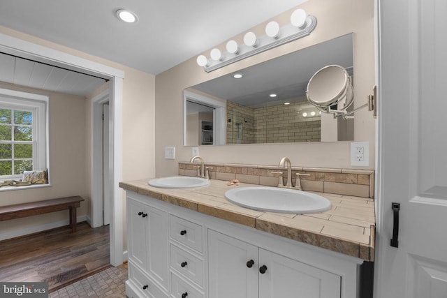 412 Nelmonte Ln, Arrington, VA 22922 - full bathroom with double vanity, a tile shower, and recessed lighting