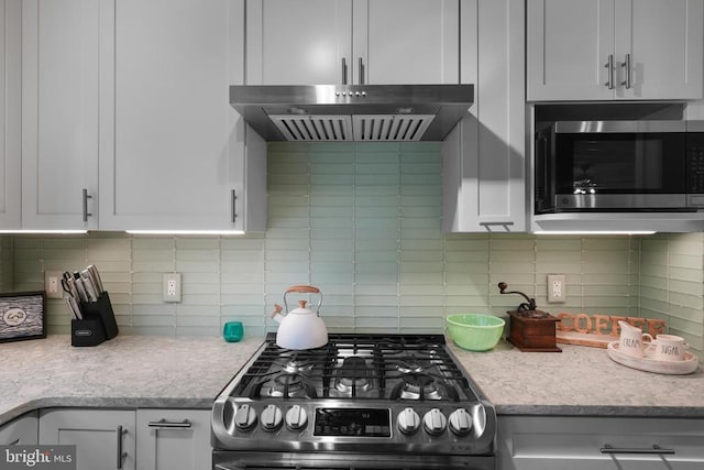 412 Nelmonte Ln, Arrington, VA 22922 - kitchen with appliances with stainless steel finishes, under cabinet range hood, tasteful backsplash, and white cabinetry