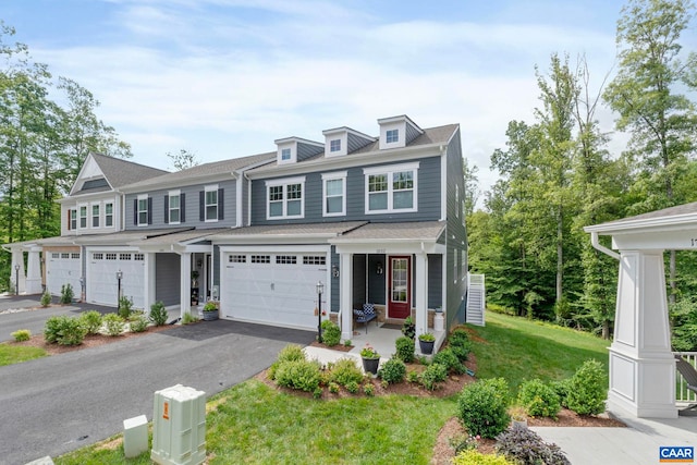 1802 Flora Ln, Charlottesville, VA 22911 - view of front of property featuring covered porch, asphalt driveway, a garage, and a front yard