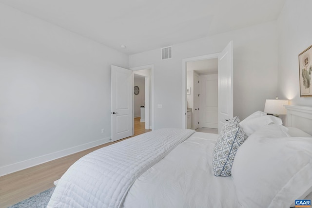 1802 Flora Ln, Charlottesville, VA 22911 - bedroom with light wood-style flooring and baseboards