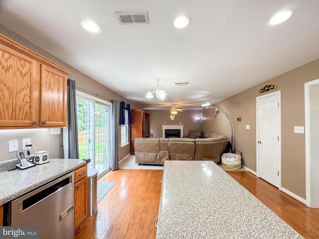 108 Apple Orchard Rd, Louisa, VA 23093 - kitchen with dishwasher, a fireplace, light countertops, light wood finished floors, and recessed lighting