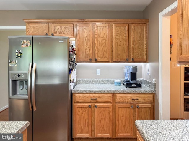 108 Apple Orchard Rd, Louisa, VA 23093 - kitchen with stainless steel fridge and brown cabinets