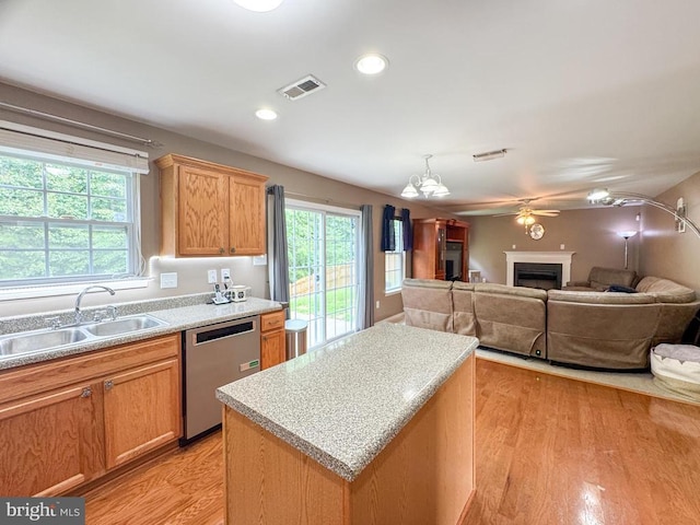 108 Apple Orchard Rd, Louisa, VA 23093 - kitchen with dishwasher, open floor plan, light wood-type flooring, a center island, and a fireplace