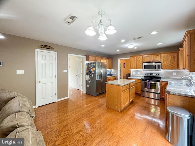 108 Apple Orchard Rd, Louisa, VA 23093 - kitchen with stainless steel appliances, open floor plan, a kitchen island, a chandelier, and recessed lighting