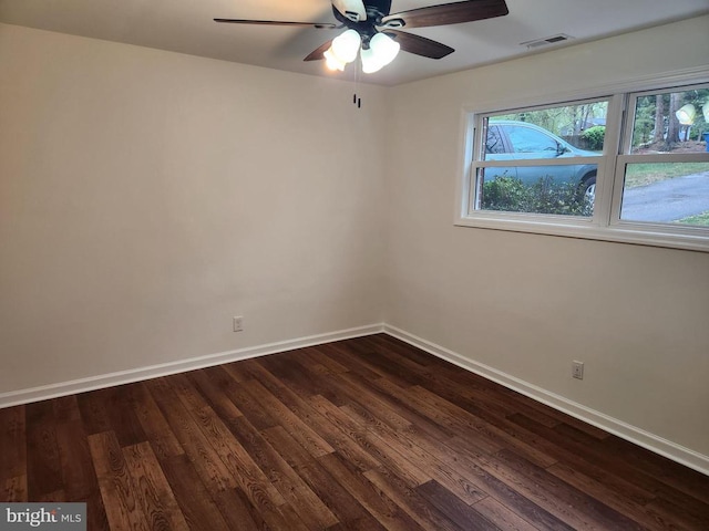 10703 Redbird Ln, Spotsylvania, VA 22553 - spare room featuring baseboards, dark wood-style floors, and ceiling fan
