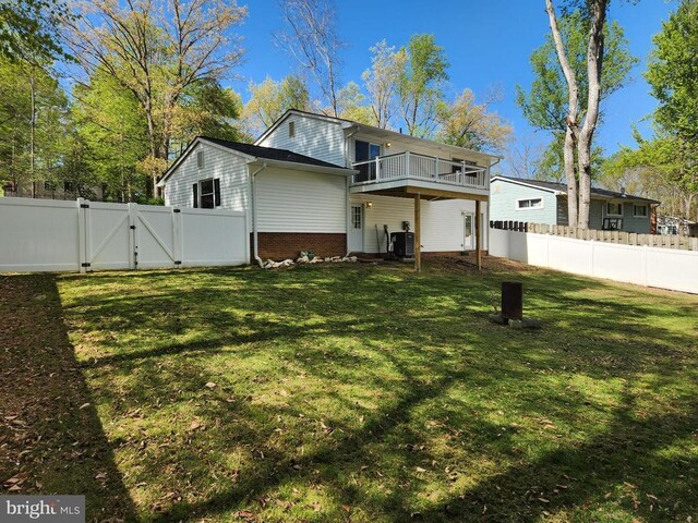 10703 Redbird Ln, Spotsylvania, VA 22553 - view of front facade with a gate, a balcony, and brick siding