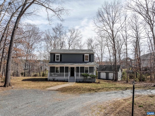 3595 Jumpers Ridge Rd, Keswick, VA 22947 - view of front of house featuring a porch, an outdoor structure, a storage shed, gravel driveway, and a shingled roof