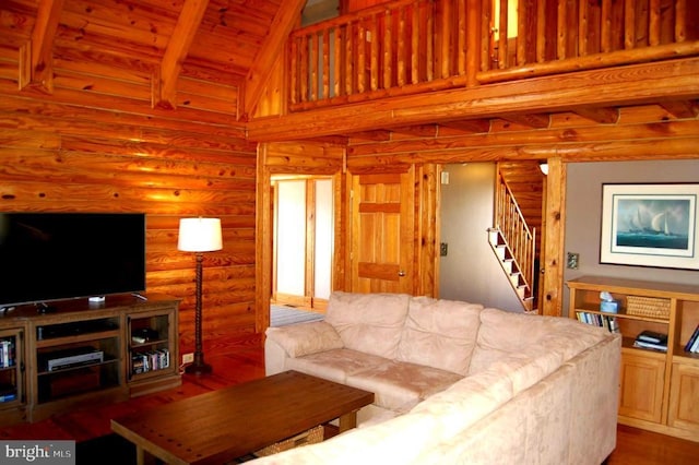 26536 Pennfields Dr, Orange, VA 22960 - living room with stairway, beam ceiling, wooden ceiling, log walls, and high vaulted ceiling