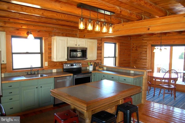 26536 Pennfields Dr, Orange, VA 22960 - kitchen with stainless steel appliances, a sink, dark wood-style flooring, beam ceiling, and pendant lighting