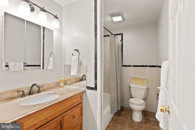 6314 Foster Rd, Spotsylvania, VA 22553 - full bath featuring tile patterned floors, vanity, tile walls, toilet, and shower / tub combo