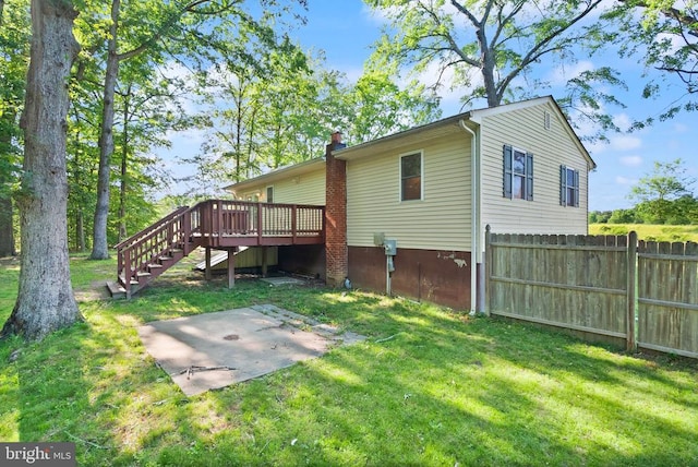 6314 Foster Rd, Spotsylvania, VA 22553 - rear view of house with a patio, a wooden deck, stairs, and a chimney