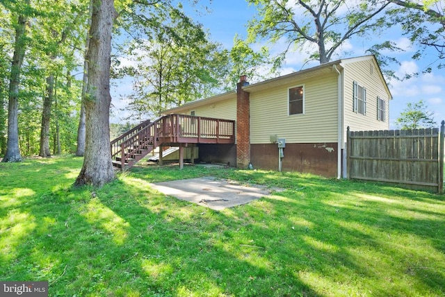 6314 Foster Rd, Spotsylvania, VA 22553 - back of property with a patio, a deck, stairs, and a chimney
